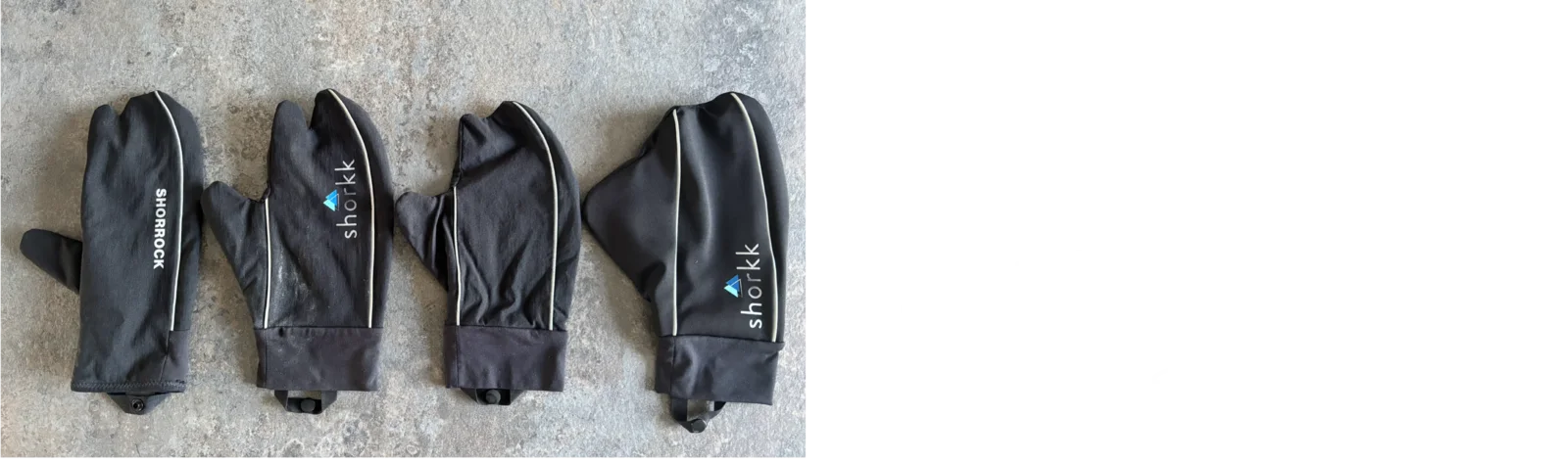 Four black shorkk prototypes laid out on the floor
